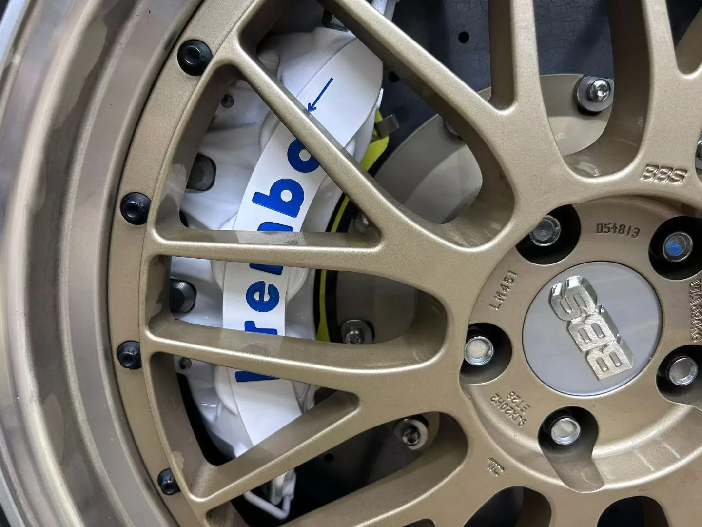 Carbon-ceramic brake conversion visible behind gold forged wheel on Toyota Alphard