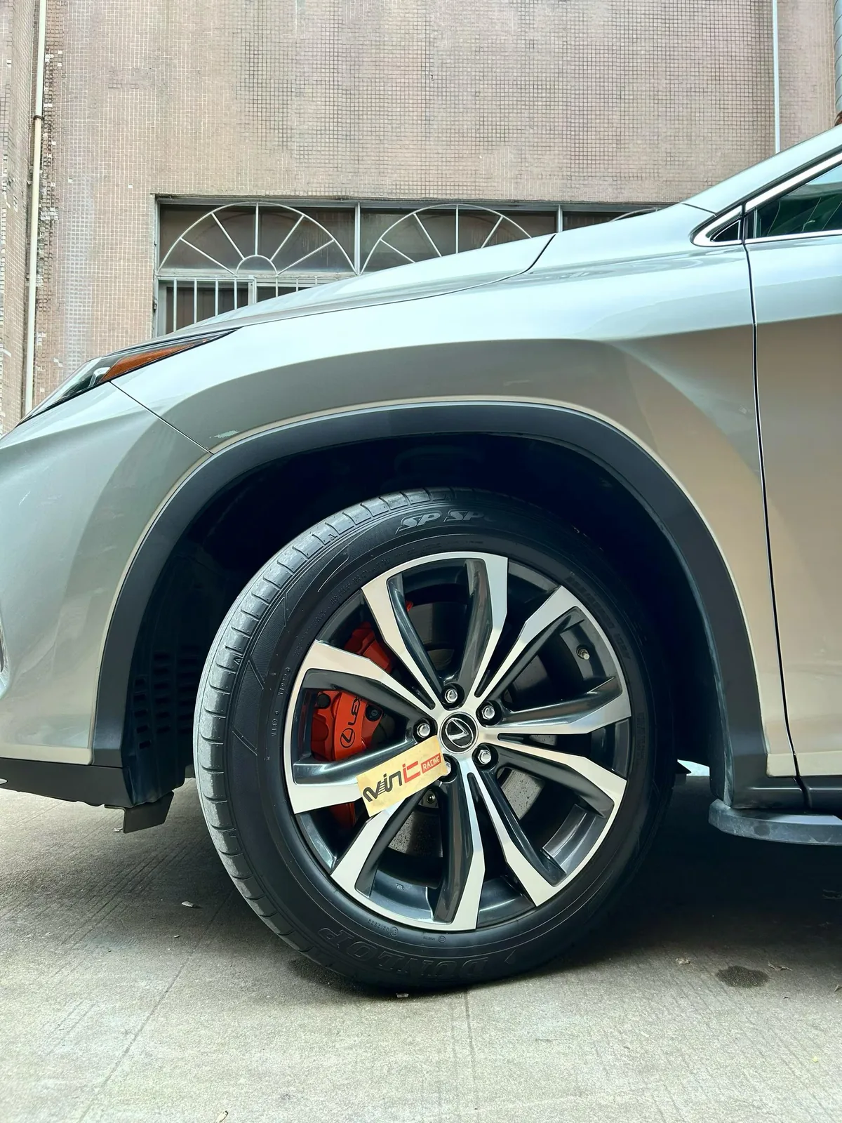 Lexus RX450h with OEM-style red caliper upgrade, VINIC install