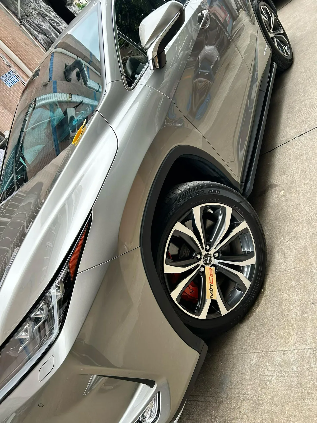 Lexus RX450h front angle showing OEM-style brake caliper upgrade