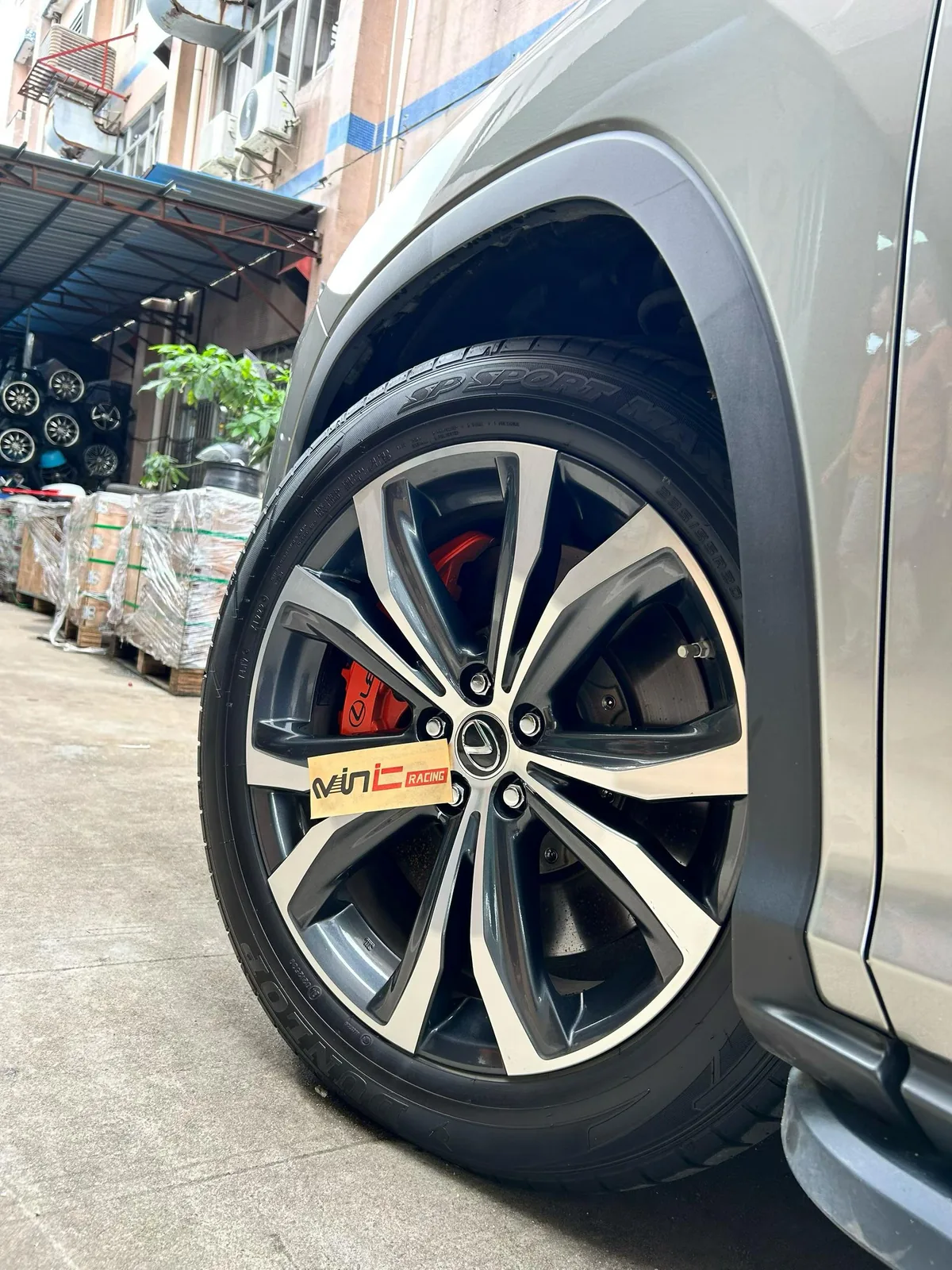 Lexus RX450h factory wheel with OEM-style red caliper upgrade